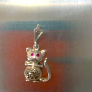Vintage sterling marcasite cat charm with pretty ruby red eyes.